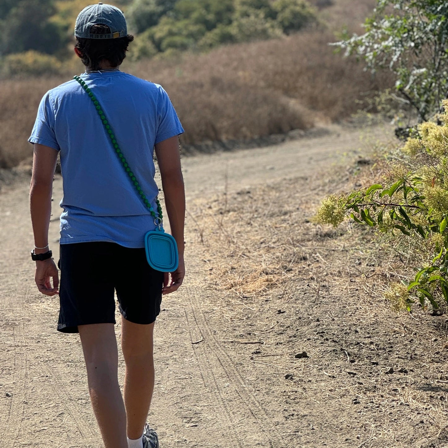 upbeads iceland worn as crossbody to click in dogs water bowel  on a hike 