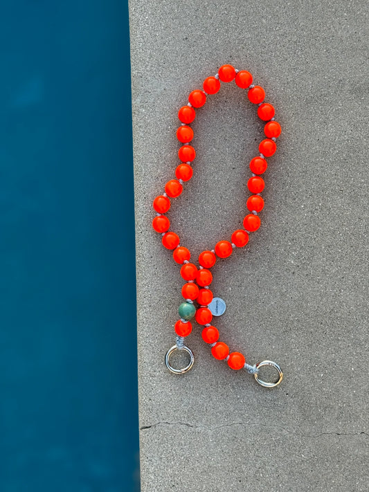 foxy upbeads neon orange cellphone chain and keychain at the pool